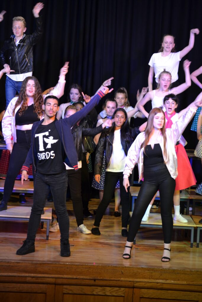 pupils performing the musical Grease