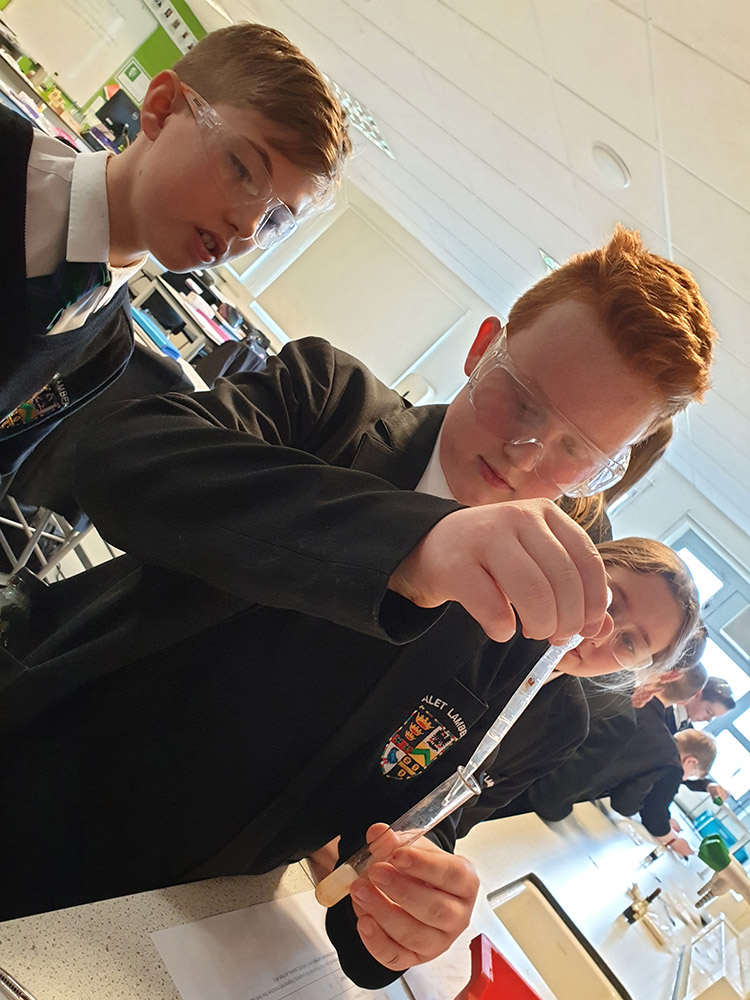 science pupils a pupil transferring a liquid to a test tube